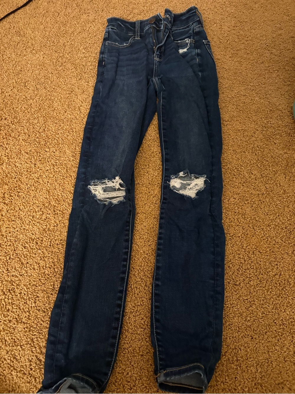 AE Women’s Dark Blue Distressed Skinny Ripped Jeans